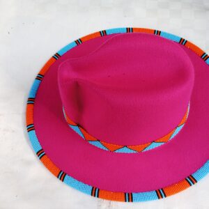 Store Wide-brim felt fedora with a hand-beaded zigzag trim along the brim and crown — a bold, handmade statement hat available in multiple colors.