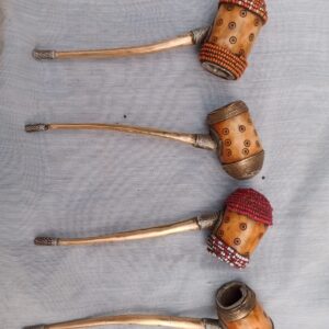 Store Authentic handcrafted African tribal smoking pipe featuring a hand-carved wooden bowl with dot engravings, wrapped in vibrant seed beadwork and brass wire detailing. A unique cultural collectible and eye-catching decor piece — perfect for art lovers and ethnic home styling.