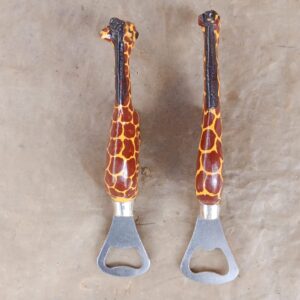 Store Hand-carved wooden giraffe bottle openers with a hand-painted giraffe-print finish and stainless steel blade — a playful pair of safari-inspired barware pieces.